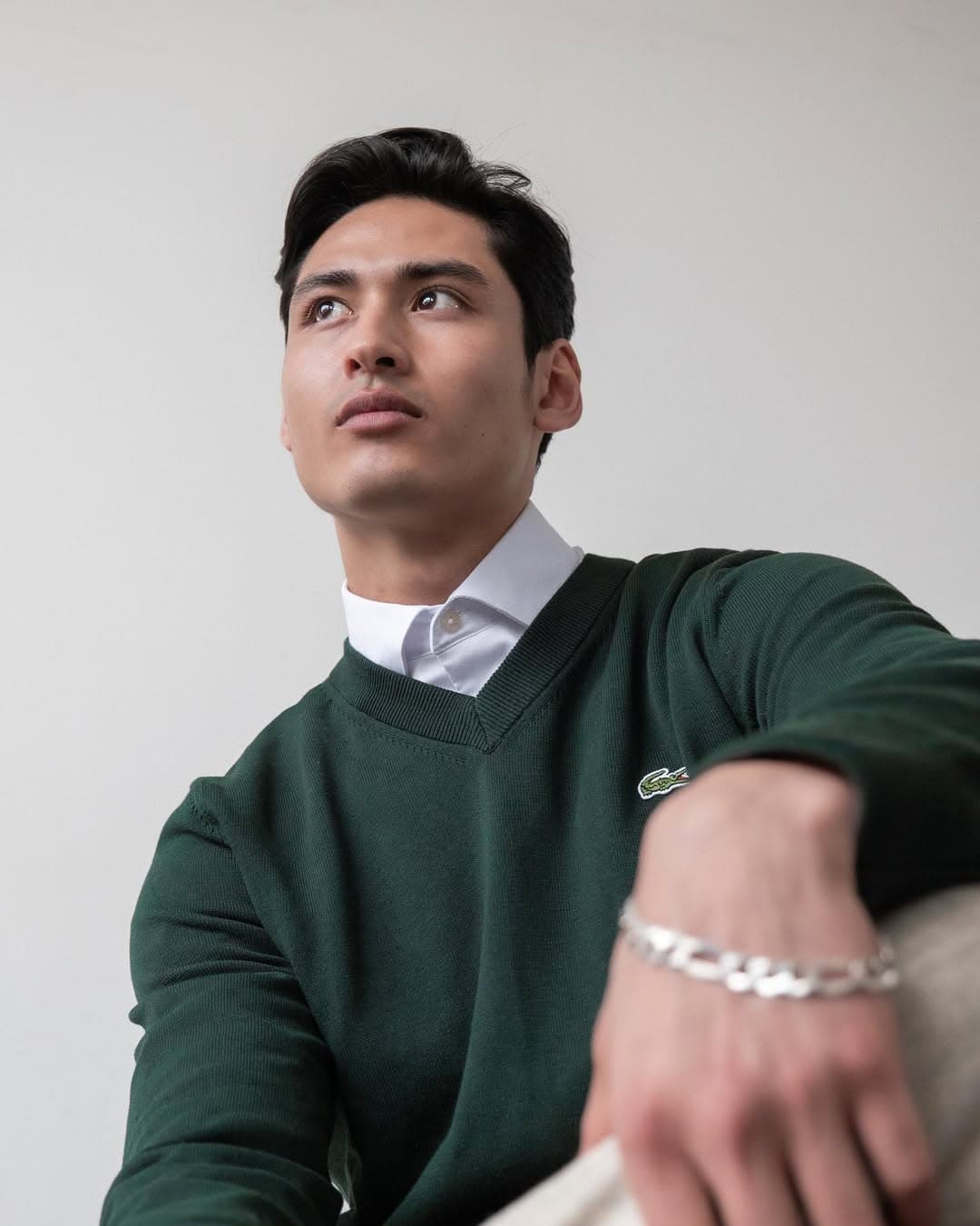 Christian Pumpelly editorial portrait in green Lacoste sweater